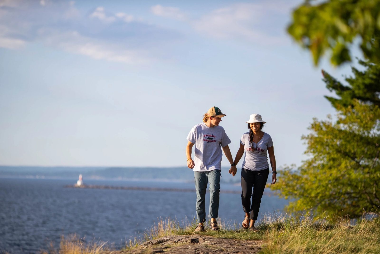 Stormy Kromer couple on a Lake Superior shoreline